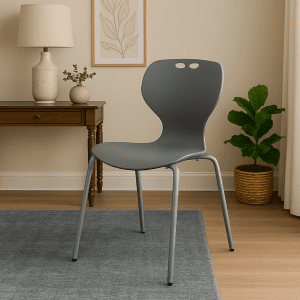 Grey bistro plastic chair with metal legs in a cozy modern interior.