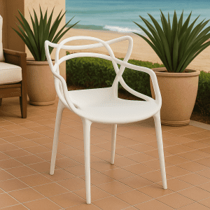 Ivory bistro plastic chair with elegant curved backrest in a stylish patio café setup.