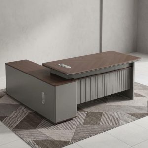 Premium L-shaped 1.6M Corporate Director Desk with a walnut wood top, grey fluted front panel, and integrated side storage cabinets.