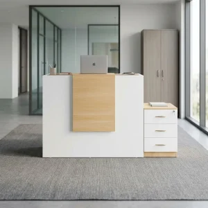 A modern white 1.6M Modern Reception Desk featuring a textured light oak vertical center panel and a matching side three-drawer pedestal with a key lock on a gray carpeted office floor.