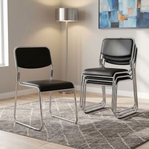 Black leather Stackable Chrome Guest Chairs stacked neatly together on an office rug.