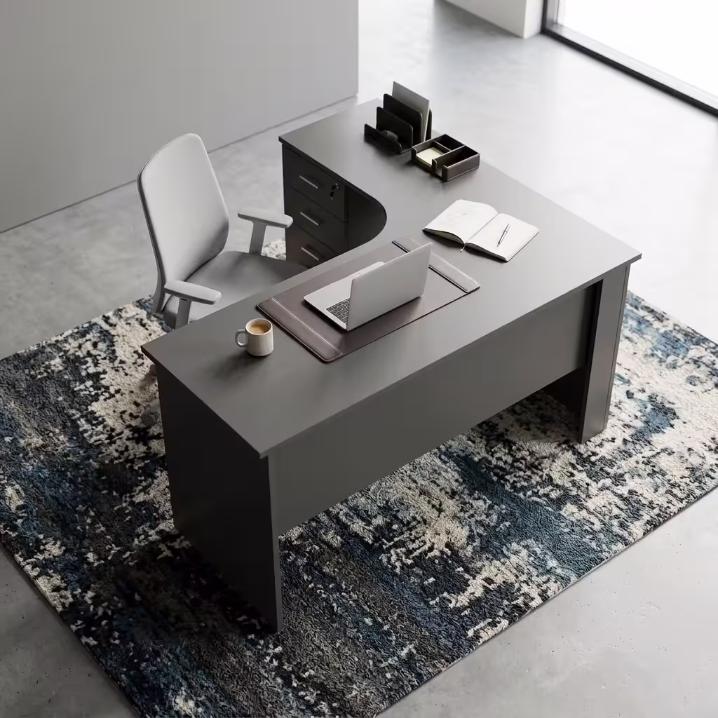 Dark grey 1200mm L-Shaped Office Desk with a built-in lockable three-drawer pedestal and a laptop on top.