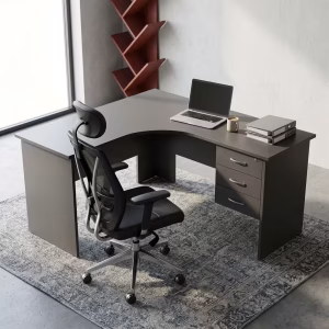 Dark grey 1200mm L-Shaped Office Desk with a built-in lockable three-drawer pedestal and a laptop on top.
