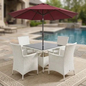 Classic Garden Outdoor Set with woven chairs, glass-top table, and large patio umbrella