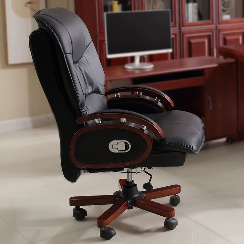 Boss executive office chair with wooden arms, leather upholstery, and recliner function
