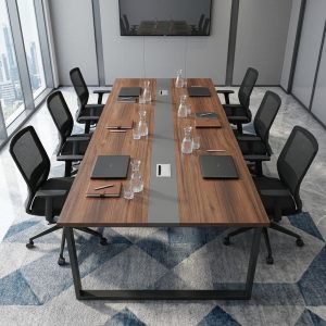 2400mm Executive Boardroom Table with rectangular brown woodgrain tabletop, dark gray central accent strip, integrated cable grommets and black metal frame legs.