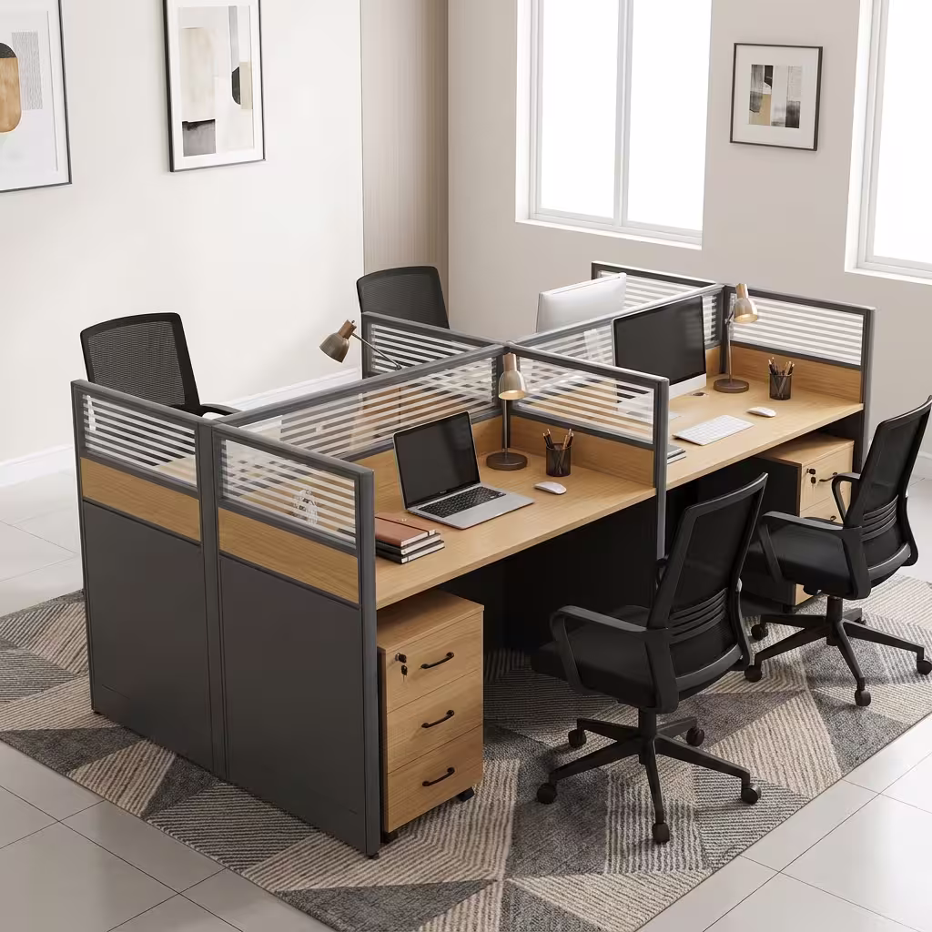 A 4-Seater Office Workstation featuring light oak-laminated desk surfaces, charcoal privacy divider screens with slatted frosted glass tops, and 3-drawer pedestals.