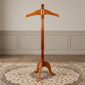 Freestanding solid mahogany wood coat stand featuring a contoured jacket hanger top piece, a turned vertical post, and a carved three-legged tripod base.