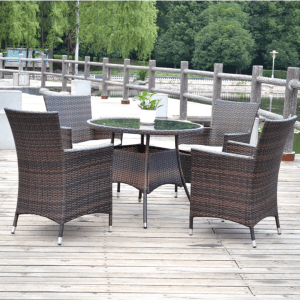 Outdoor Rattan Dining Set with round glass table and four patio chairs