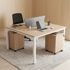 2-Person Office Workstation Desk with light wood-grain desktop, grey central privacy divider, white metal frame, cable openings and mobile storage pedestals.
