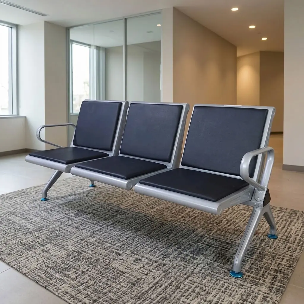Black Leather Padded Link Chair with three black padded seats and backrests, silver metal frame, curved end armrests and angled support legs.