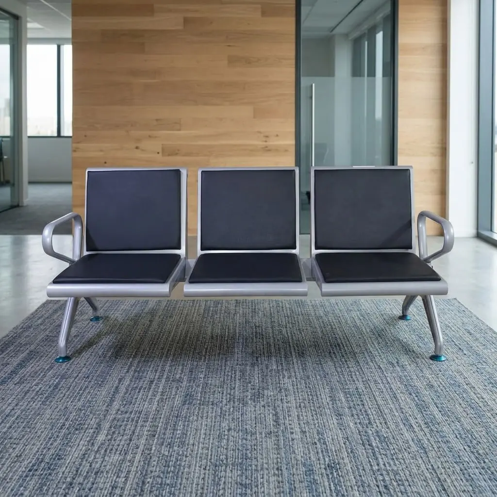 Black Leather Padded Link Chair with three black padded seats and backrests, silver metal frame, curved end armrests and angled support legs.