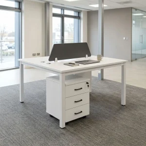 Double-sided white office desk featuring a central gray privacy divider panel and a lockable three-drawer mobile filing cabinet underneath.