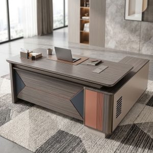 Premium Executive Office Desk 1.8m with gray wood-grain tabletop, geometric front modesty panel, integrated side cabinet, and copper-toned decorative accents.