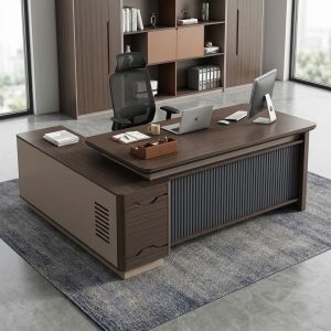 Modern 1.8m Executive Desk with gray-brown wood-grain finish, spacious rectangular tabletop, rounded corners, L-shaped side return, open shelves, and lockable storage cabinet.
