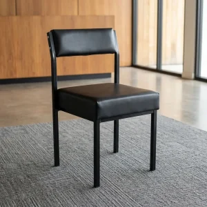 A Black Leather Visitor Office Chair featuring a low-profile rectangular backrest, a thick square seat cushion, and a matte black geometric metal frame.
