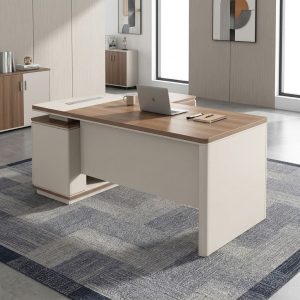 L-shaped executive office desk featuring a wood-grain and beige laminate finish, integrated side storage credenza, and a built-in silver cable outlet strip.