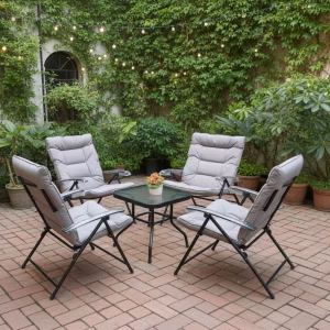 A 4 Seater Folding Patio Conversation Set featuring a square black metal coffee table with a tempered glass top and four matching folding chairs with thick grey cushions.