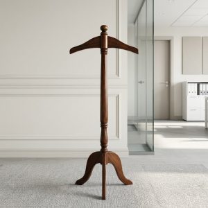 A Wooden Coat Hanger Stand featuring a polished mahogany-finished solid wood frame, a contoured suit hanger top, an ornamental column, and three arched legs.
