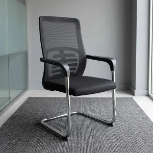 A Black Mesh Visitor Office Chair featuring a black mesh backrest with a geometric lumbar pattern, padded armrests, and a polished chrome cantilever base.