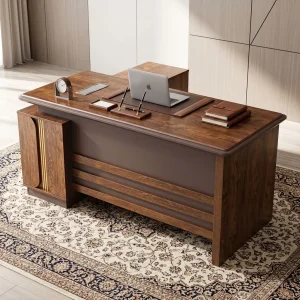 A 1.8m L-Shaped Boss Desk featuring a teak wood grain floating desktop, a dark charcoal modesty panel, gold vertical accents, and an integrated side credenza.