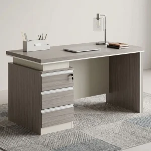 A 1.6m Modern Grey Office Desk featuring a grey wood grain desktop, an integrated lockable three-drawer pedestal, and a matching modesty panel