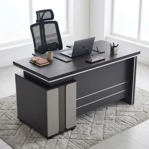 A modern executive desk with a dark mahogany wood-grain finish featuring a thick floating-style rectangular top accented by an underlying silver trim line and an integrated under-desk pedestal on the right side containing three drawers with sleek silver horizontal handles and a key lock.