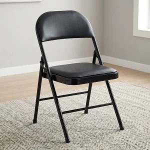 A commercial Black Padded Folding Chair featuring a matching matte black tubular steel cross-braced frame, a square-contoured padded black faux leather backrest, a thick cushioned seat, and non-marring floor caps on the base of its legs.