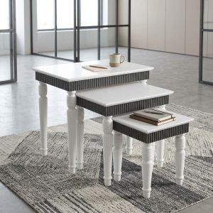 Premium Nesting Tables Set featuring three graduated rectangular white tabletops, dark grey ribbed apron panels, and decorative white turned legs.